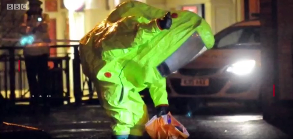 Police wearing hazmat gear gather evidence where former Russian spy Sergei Skripal was found after being poisoned by unidentified attackers using a military-grade chemical weapon. Screengrab from BBC news coverage. 9march2018